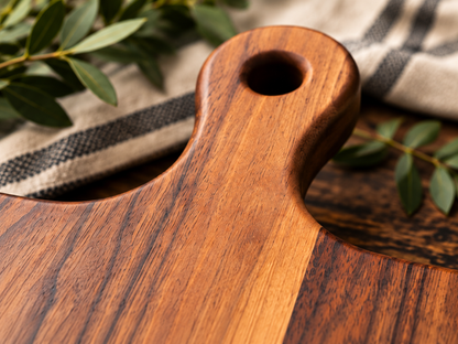 Close-up of walnut cutting board handle and engraved recipe detail